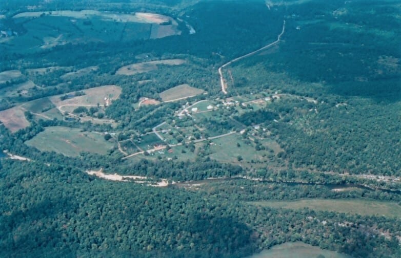 An aerial view shows the middle Buffalo River winding through gravel bars and wooded hills near the Tyler Bend and Grinders Ferry corridor.