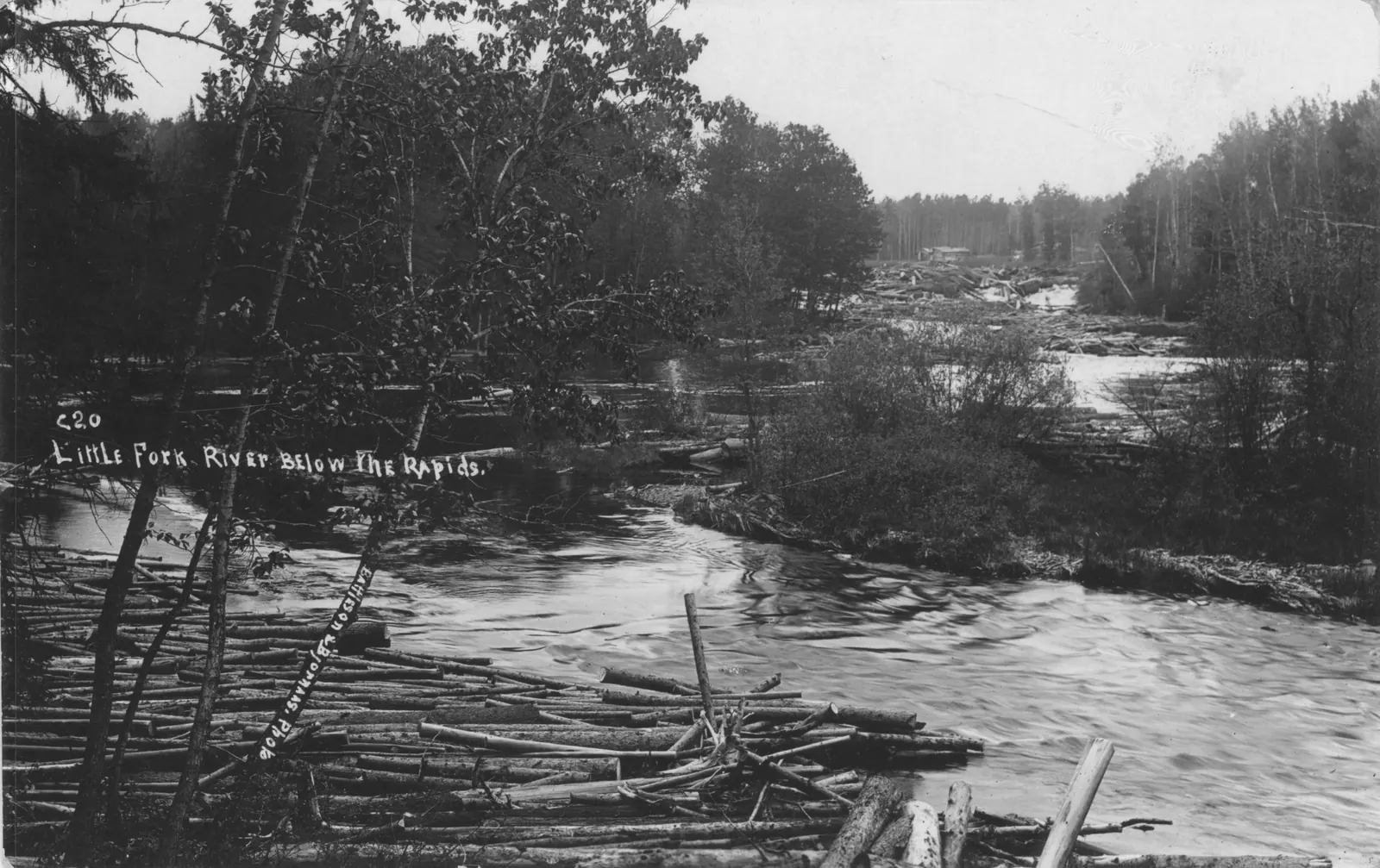 The Little Fork River tumbles through a rocky rapid below tree-lined banks near Cook, Minnesota.