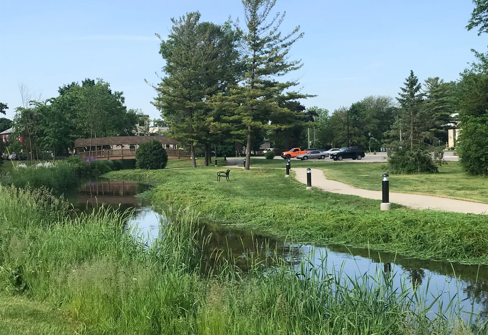 The Bark River runs through a wooded greenway in Hartland, Wisconsin.