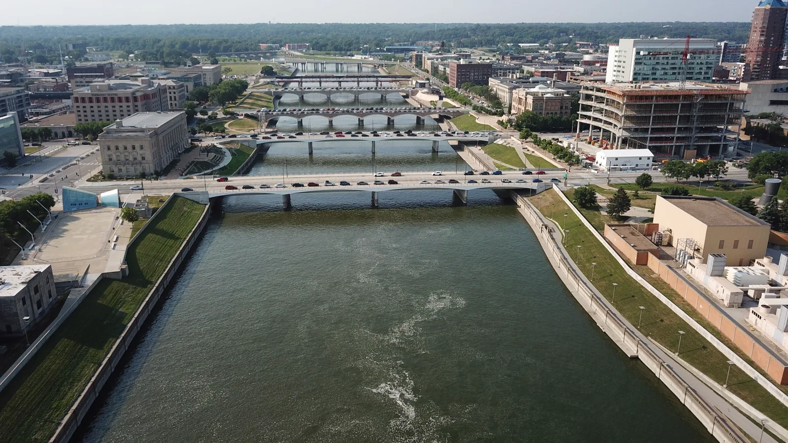 The Des Moines River runs past bridges and downtown buildings in Des Moines, Iowa.