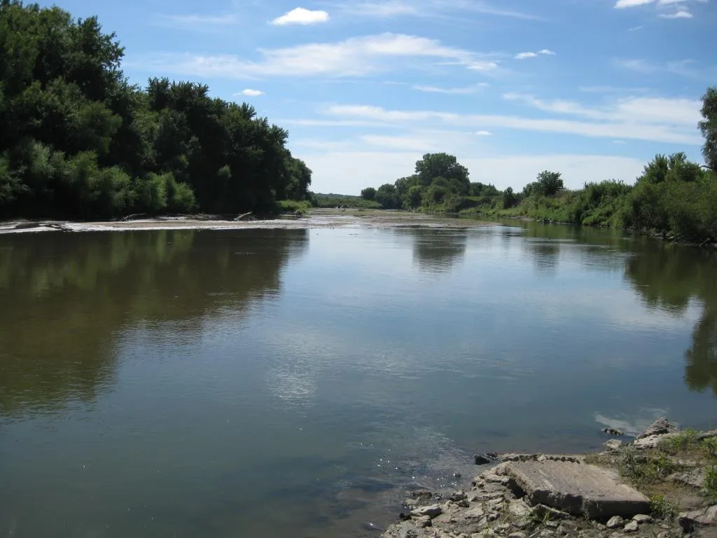 The East Nishnabotna River flows between wooded banks near the National Water Prediction Service gauge at Elliott, Iowa.