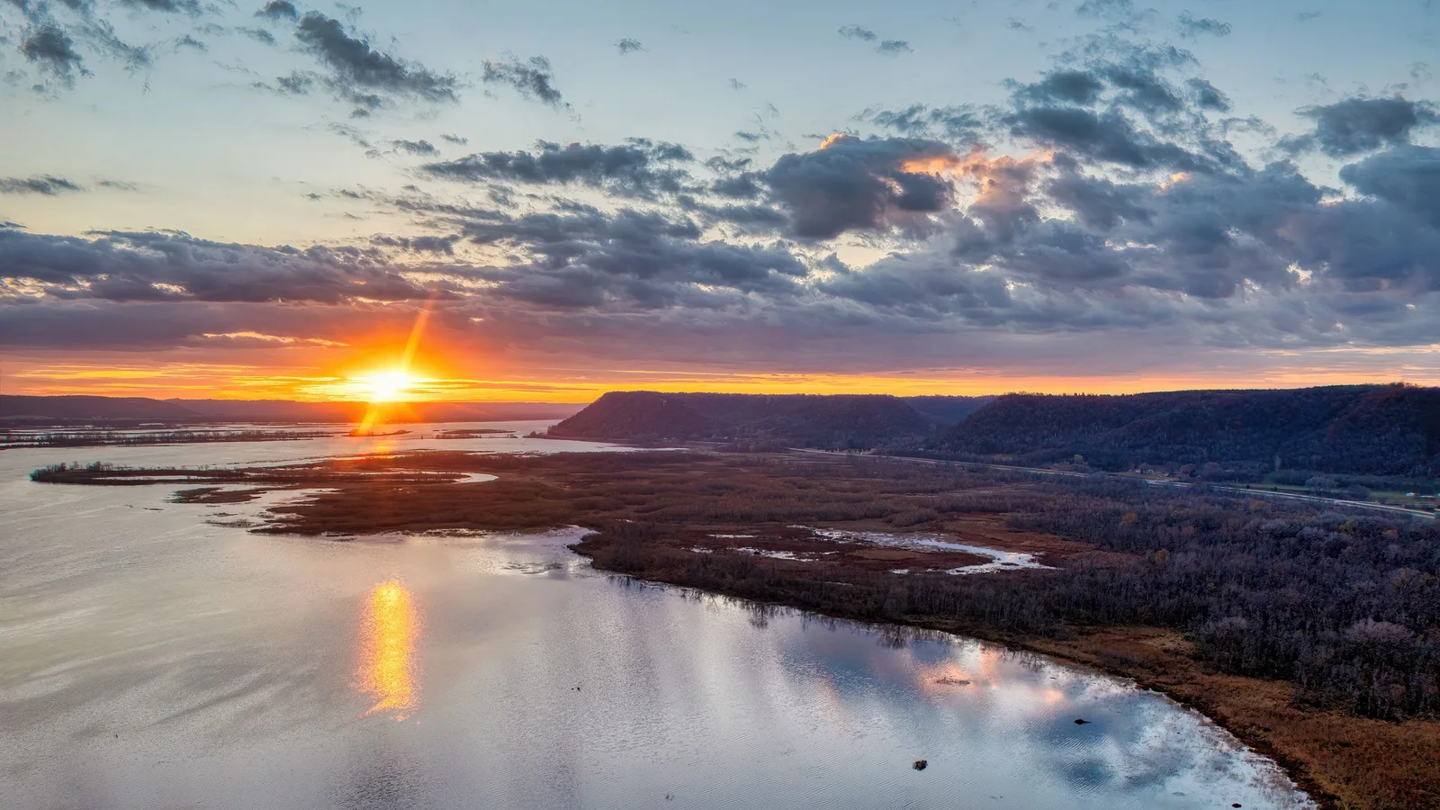 Sunset reflects across the Mississippi River backwaters near Weaver, Minnesota.