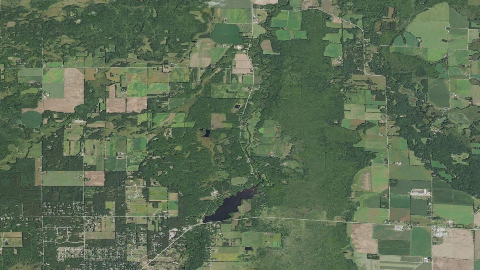 Aerial orthoimagery shows the Plover River corridor between County Highway K and Jordan Park, Wisconsin.