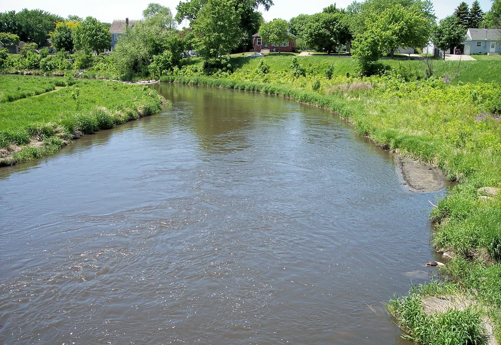The Pomme de Terre River flows past wooded banks at Appleton, Minnesota.