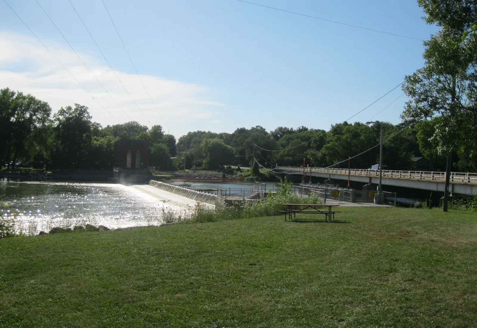 The Rock River flows past wooded banks at Indianford, Wisconsin.
