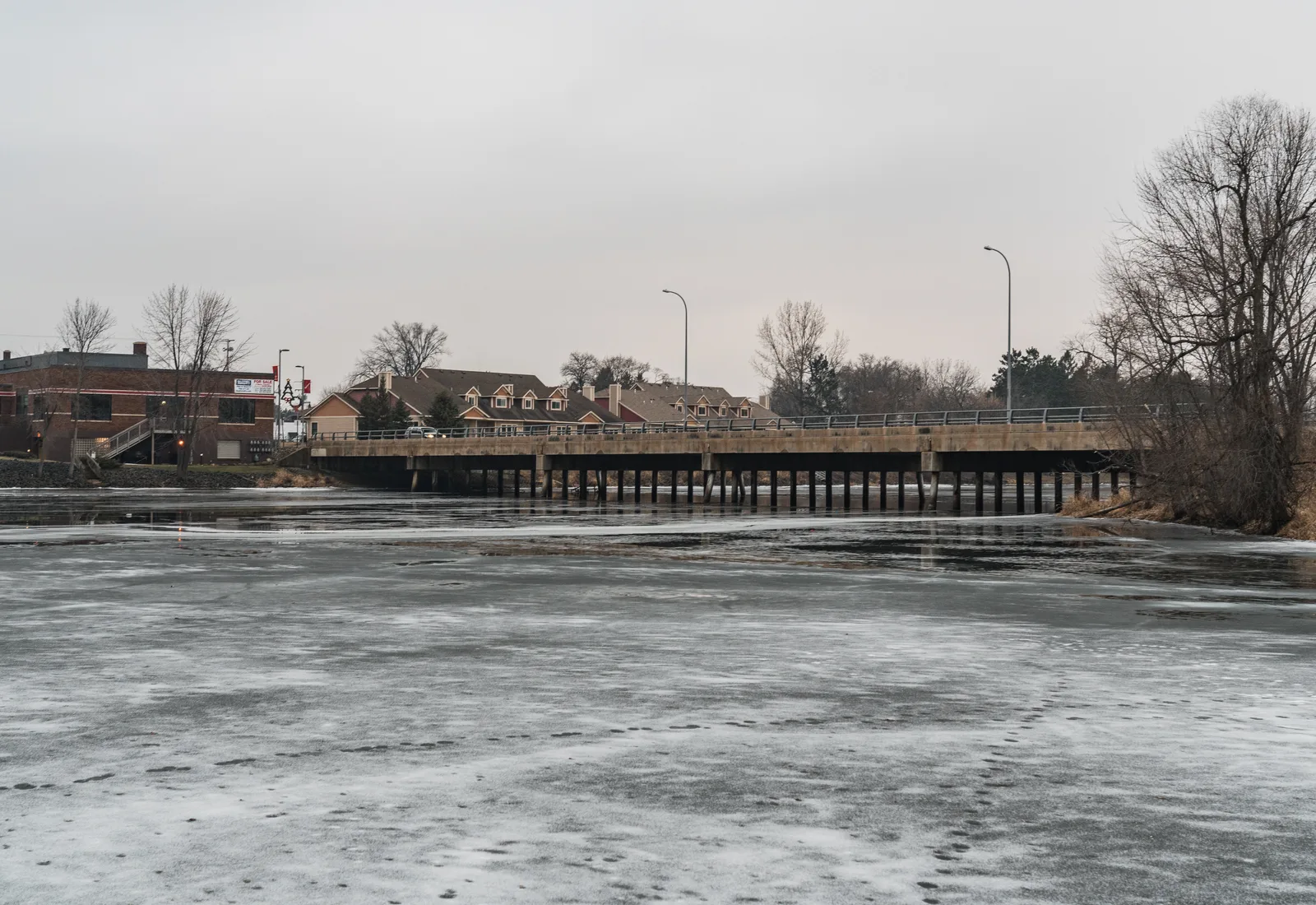 The Snake River winds through Pine City, Minnesota in winter.