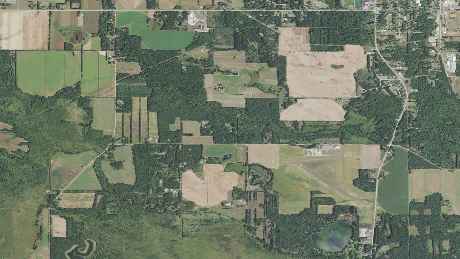 Aerial orthoimagery shows the West Branch White River corridor near Cottonville Avenue, Wisconsin.
